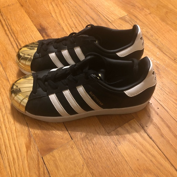 adidas Shoes - Adidas Black, white and Gold sneakers.
